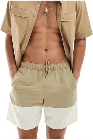 ASOS Swim shorts in mid length in khaki block print
