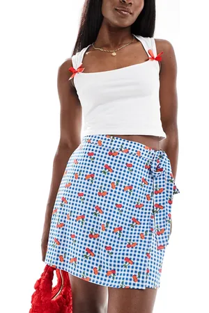 Pieces® Wrap front mini skirt in gingham cherry print