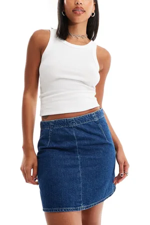 Calvin Klein Mid rise a line darted mini skirt in mid wash