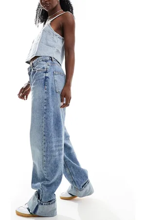 Bershka Deep turn up balloon jeans in mid wash