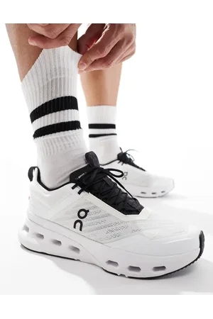 On Running ON Cloudnova X training trainers in white and