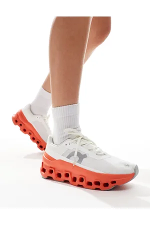 On Running ON Cloudmonster running trainers in and red