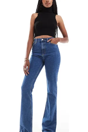 ASOS ASOS DESIGN Tall mid rise flare jeans in mid