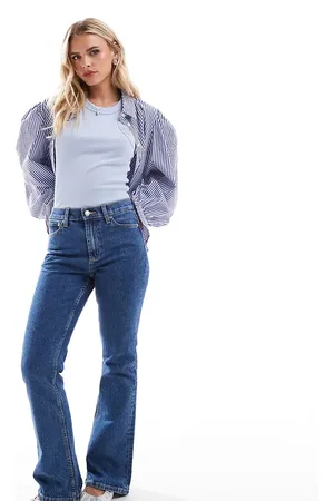 ASOS ASOS DESIGN Petite mid rise flare jeans in mid