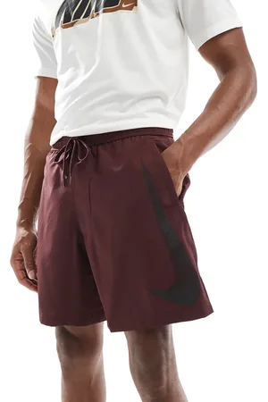 Nike Swoosh graphic 7 inch shorts in burgundy