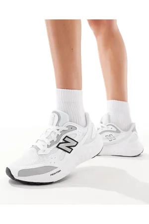 New Balance Arishi running trainers in white and