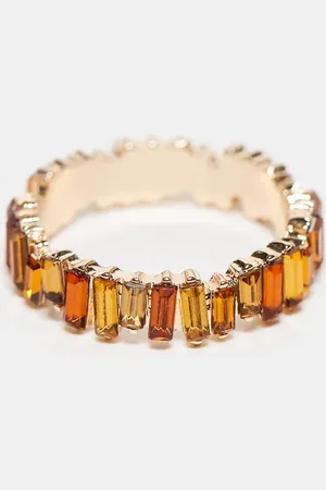 ASOS Baguette ring with amber tonal stones in gold tone