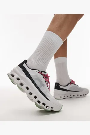 On Running ON Cloudmonster running trainers in white and