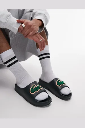 Lacoste Serve 2.0 sliders in dark with textured logo