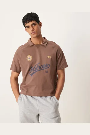 ASOS Boxy oversized polo with sports graphic in