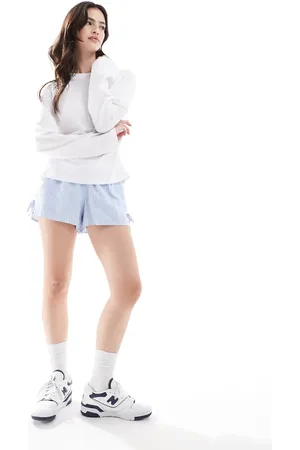 Hollister Pull on tie waist flippy short in blue and stripe