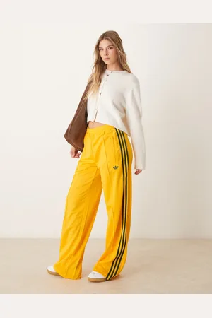 adidas Firebird Loose track pants in yellow