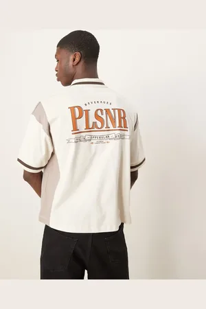 ASOS Boxy oversized zipped polo with cut and sew panelling and text graphic in cream