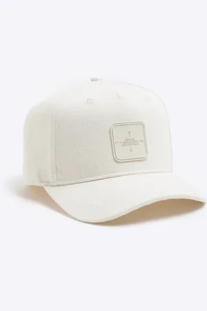 River Island Rubber badge baseball cap in ecru