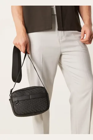 ASOS Faux leather crossbody bag with monogram detail in