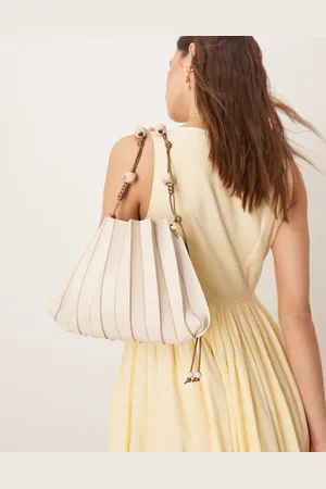 ASOS Pleat detail shoulder bag with resin ball and knot strap detail in cream