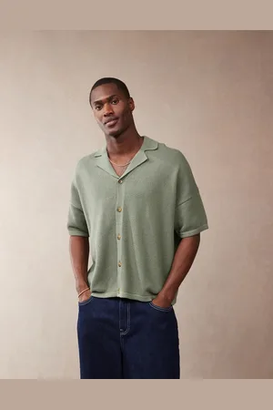 ASOS Oversized boxy fit knitted texture revere neck button through polo in