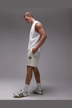 Lacoste Jersey shorts in with tennis emblem