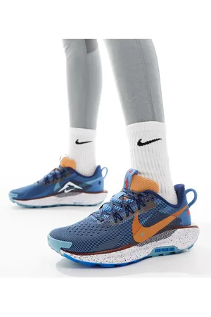 Nike ReactX Pegasus Trail 5 trainers in navy and