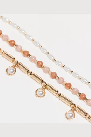 ASOS Pack of 3 braided bracelets with faux pearl charm detail in tone