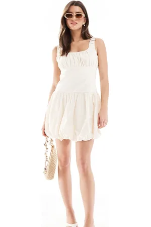 The Frolic Exclusive poplin ruched bust dropped waist puffball mini dress in cream