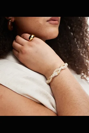 ASOS ASOS DESIGN Curve bracelet with faux shell and bead design