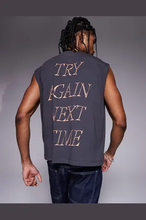 ASOS Boxy oversized vest with front and back sports graphics in charcoal