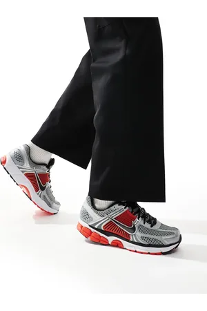 Nike Zoom Vomero 5 trainers in metallic and black