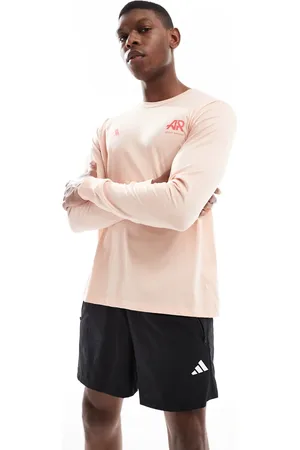 adidas Adidas Running Own The Run long sleeve top in coral