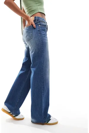 Monki Imoo low waisted wide fit jeans in gabby wash with spray