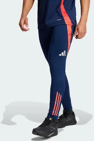 adidas Manchester united tiro 24 training pants in night indigo / bright red