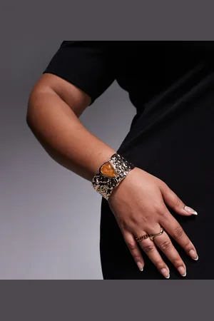 ASOS ASOS DESIGN Curve Limited Edition cuff bracelet with abstract textured molten in tone