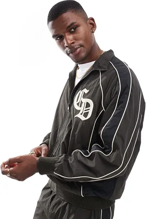 Criminal Damage Panelled training jacket in black/chocolate