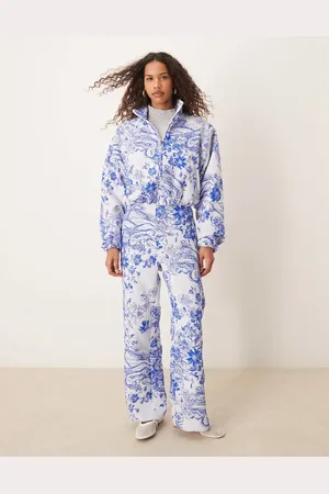 Nike MDC jaquard floral wide leg trousers in blue and white