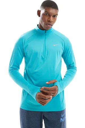 Nike Stride Dri-FIT half zip longsleeve top in turquoise