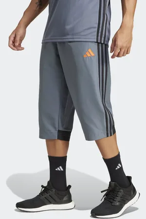 adidas Tiro 25 essentials woven 3/4 pants in team onix / / super oran