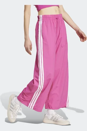 adidas Essentials 3-stripes lifestyle woven parachute pants in semi lucid fuchsia / white
