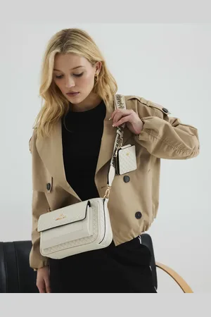 River Island Ri monogram pouchette cross body bag in cream