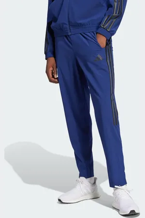 adidas House of tiro woven pants in dark / black
