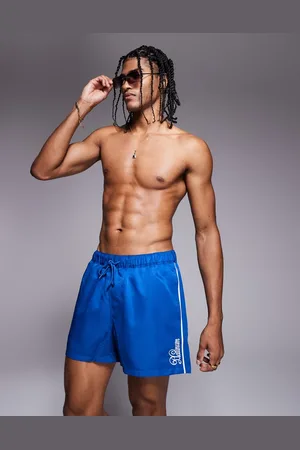 ASOS Swim shorts in short length with embroidered detail in
