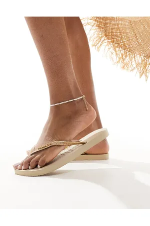 Havaianas Slim glitter flip flops in golden sand