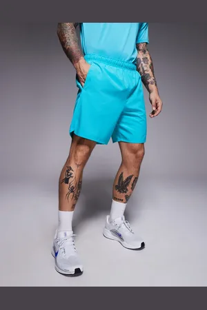 Nike Challenger Dri-FIT 7 inch shorts in turquoise