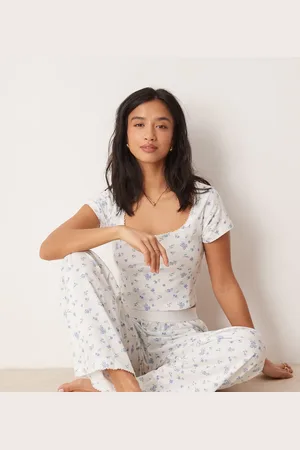 ASOS ASOS DESIGN Petite mix & match pyjama trouser with exposed waistband and picot trim in ditsy print