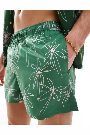 ASOS Swim shorts in mid length in doodle palm tree print