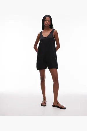 ARKET Pure linen beach playsuit with deep v-neck and pocket detail in