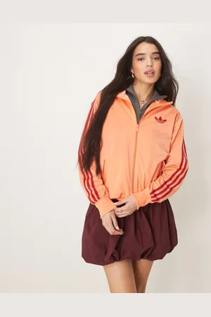 adidas Firebird track top in orange and red