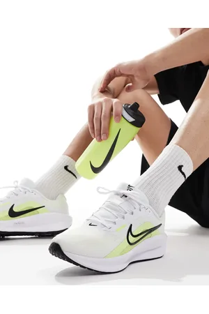 Nike Downshifter 13 trainers in white and