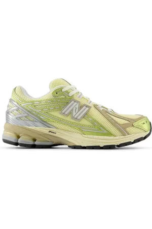 New Balance 1906r trainers in yellow and beige