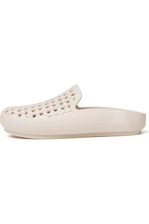 Freedom Moses Cream clogs with rattan shape holes in cream