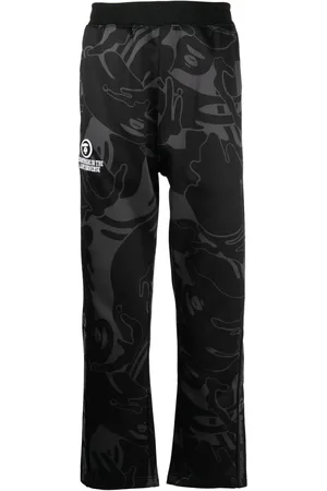 A Bathing Ape Graphic-print logo-patch trousers